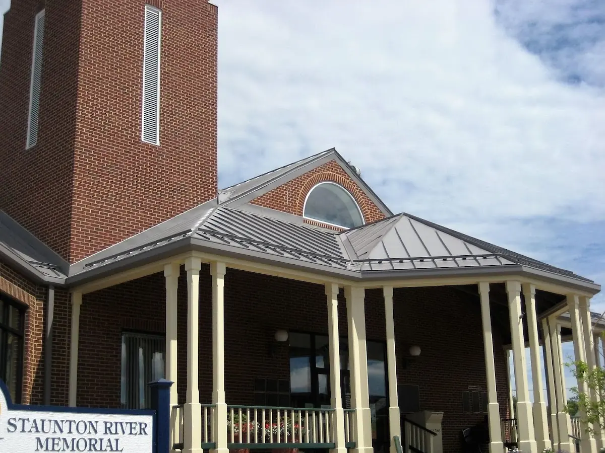 Skilled roofing craftsmen working on a residential roof in Jonesville